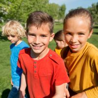 medium-shot-happy-kids-outside_23-2149018926