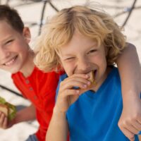 medium-shot-kids-eating-sandwich